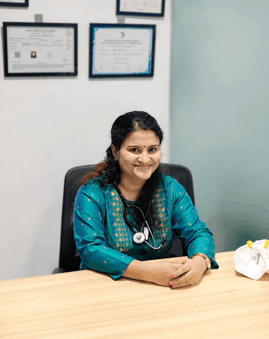 Dr. Anju Bala consulting in clinic